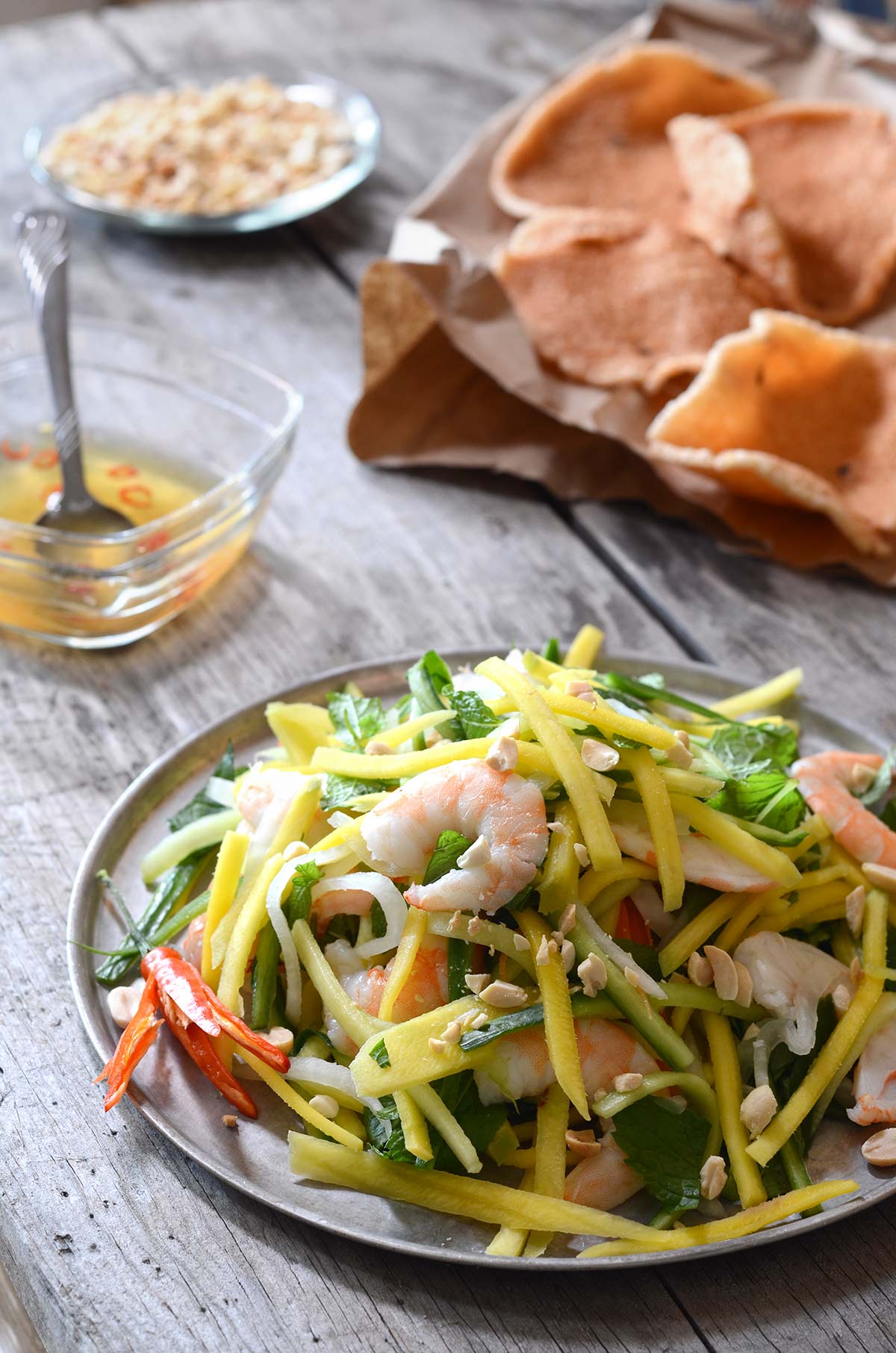plate of Vietnamese mango salad with shrimp chips