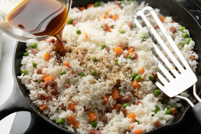 adding seasoning to rice