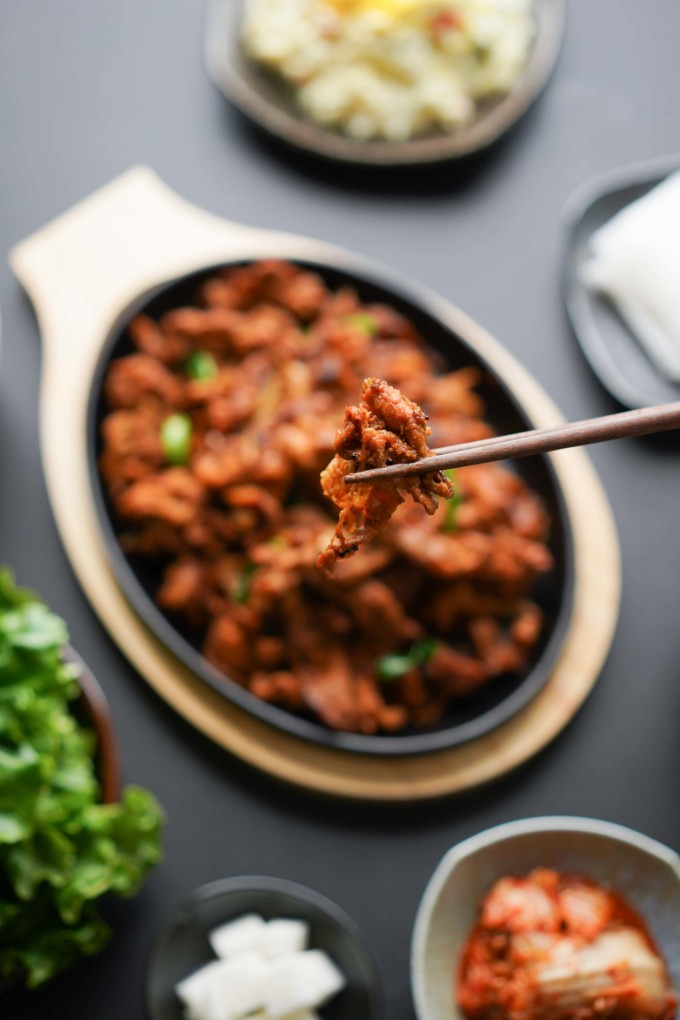 spicy pork bulgogi on chopsticks