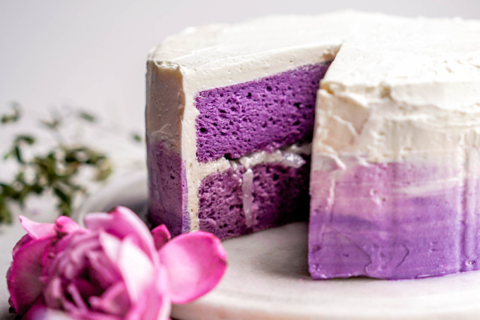 whole Filipino ube cake with slice taken out